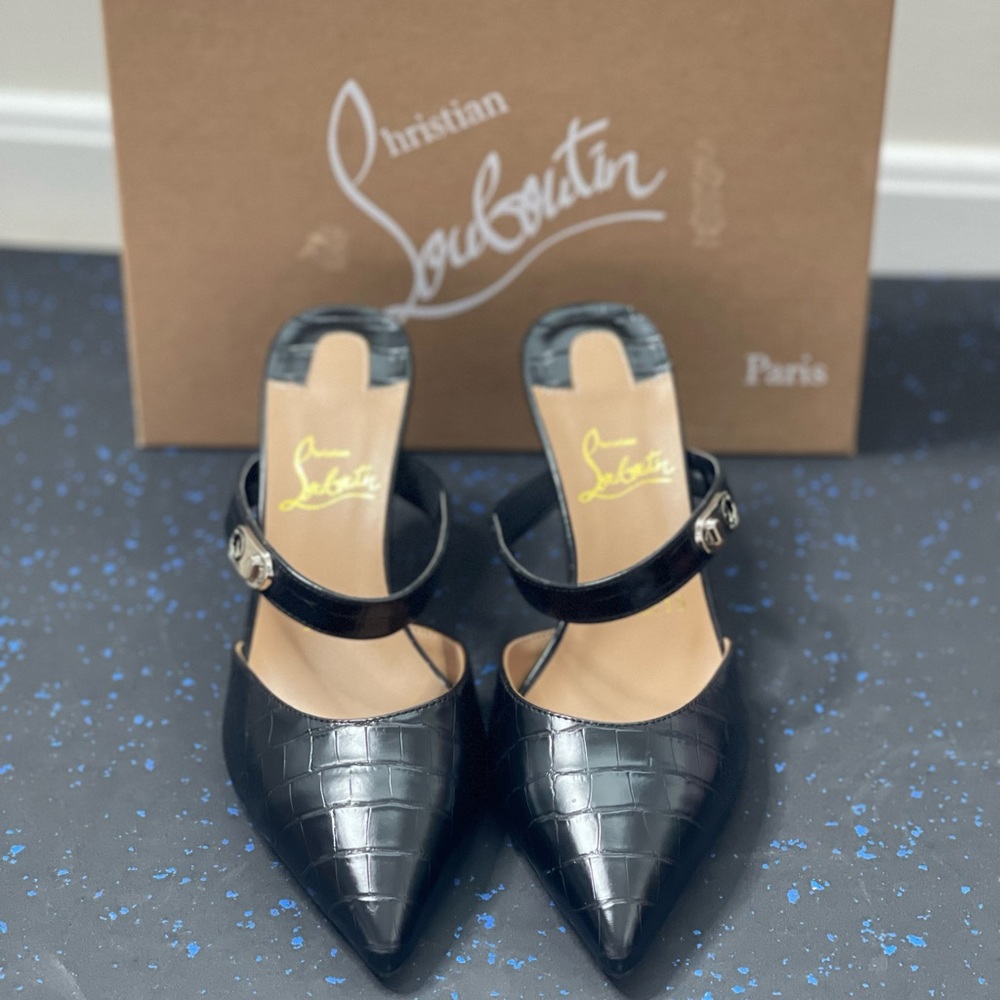 Brand new never worn Christian Louboutin mules.